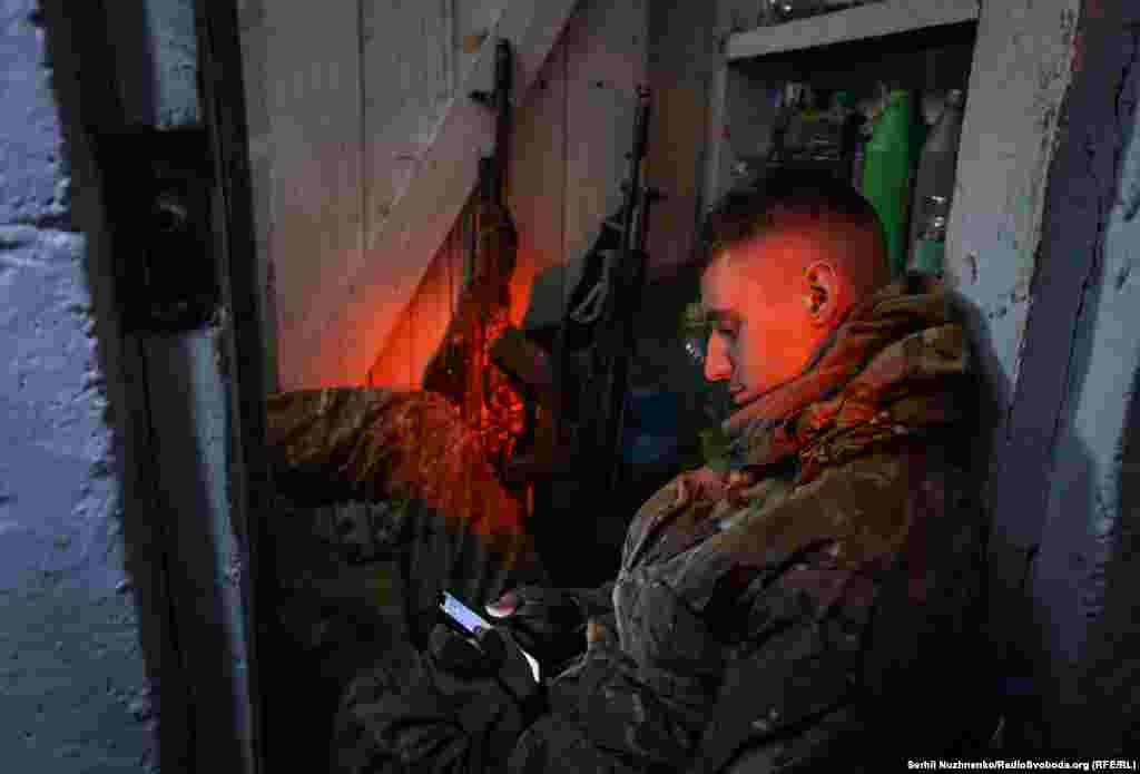 A Ukrainian soldier of the 15th Operative Purpose Brigade Kara-Dag of the National Guard rests in a shelter at a front line near the town of Pokrovsk in the Donetsk region, Ukraine.