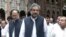 FILE: Former Pakistani Prime Minister Shahid Khaqan Abbasi (C) leaves a court in Lahore in June 2018.