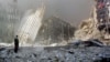 U.S. -- A man stands in the rubble, and calls out asking if anyone needs help, after the collapse of the first World Trade Center Tower in New York City, 11Sep2001