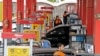 Iranian drivers fill their tanks at a gas station in the capital Tehran, November 5, 2018