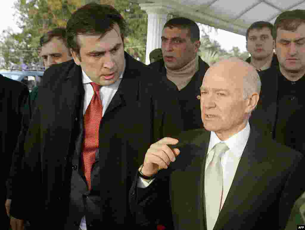 Georgian President Mikheil Saakashvili (left) talking to Aslan Abashidze (right), leader of the autonomous region of Ajara, during a meeting in Batumi on March 18, 2004. Abashidze, a former Communist Party official, ran Ajara as his personal fiefdom for more than a decade. He relinquished power and fled Georgia in May 2004, an event considered a major victory for Saakashvili.