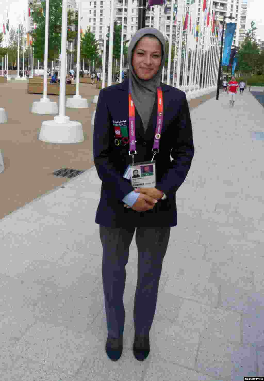 Afghan sprinter Tahmina Kohestani wears the team's simple suit before the Games -- but for the Opening Ceremony, she's expected to be the only team member in Afghan national dress.