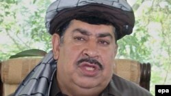 Gul Agha Sherzai, Governor of Ningarhar province speaks with journalists about the explosives seized by Afghan police, in Jalalabad, 8 May 2006