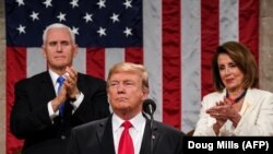 File photo - U.S. President Donald Trump delivers the State of the Union address, alongside Vice President Mike Pence and Speaker of the House Nancy Pelosi, at the US Capitol in Washington, February 5, 2019