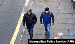 A picture taken on Fisherton Road in Salisbury on March 4 and released by the British Metropolitan Police Service on September 5 shows Aleksandr Petrov (right) and Ruslan Boshirov