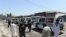 Ambulances transport the bodies of Afghan Sikhs killed in a suicide attack in Jalalabad on July 2.