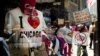  Demonstrators are reflected in a souvenir shop window in Chicago, Illinois, as peace activists march through the street demanding an end to NATO violence ahead of the summit.