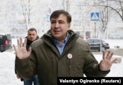 Ukrainian opposition figure and former Georgian President Mikheil Saakashvili reacts before visiting the Prosecutor-General's Office in Kyiv on December 18.