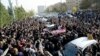 Mourners pay their respects to Morteza Pashaei outside the Tehran hospital where he died on November 14. The last time Iranians took to the streets spontaneously in such large numbers was following the disputed 2009 presidential election.