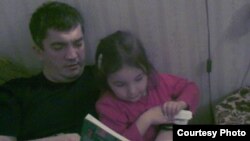 Daghestan anesthesiologist Marat Gunashev (with daughter) in an undated photo obtained in January 2013