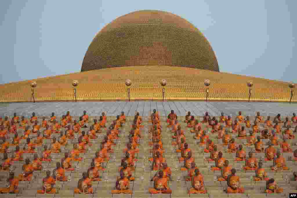 Buddhist monks meditate during a ceremony at the Dhammakaya Temple in Bangkok, Thailand. (AFP/Nicolas Asfouri)