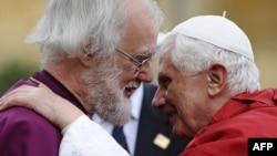 Britain's archbishop of Canterbury, Rowan Williams (left), greets Pope Benedict XVI at Lambeth Palace in central London