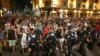 Protesters march through central Bucharest on August 12, the third consecutive night of antigovernment demonstrations in Romania.