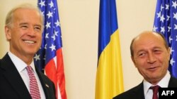 Romanian President Traian Basescu (right) says the topic came up during an October visit by U.S. Vice President Joe Biden.