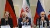 Switzerland -- (L-R) EU foreign policy chief Federica Mogherini, Iranian Foreign Minister Mohammad Javad Zarif and Head of Iran Atomic Energy Organization Ali Akbar Salehi wait for the opening of a plenary session on Iran nuclear talks in 2015.