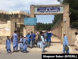 Students in front of Fakhr Al-Madares, an Islamic school in the western Afghan city of Herat.