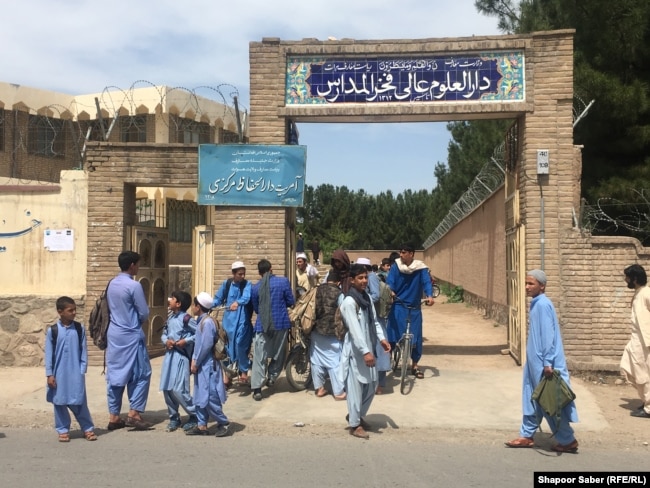 Students in front of Fakhr Al-Madares, an Islamic school in the western Afghan city of Herat.