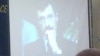 Фотография Евгения Жовтиса на телевизионном экране в зале заседания конференции «35 лет Хельсинкского движения: прош¬лое, настоящее, будущее». Москва, 12 мая 2011 года.