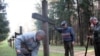 Belarus -- In memorial Kurapaty people restore the crosses tumbled down by vandals, 29Oct2008