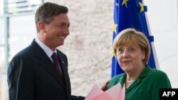 Angela Merkel, cancelarul german și Borut Pahor, președintele Sloveniei, la întîlnirea lor de la Berlin, la 25 aprilie