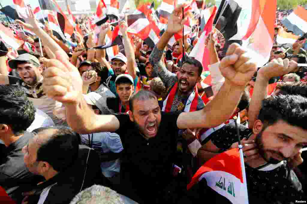 Supporters of Iraqi Shi'ite cleric Moqtada al-Sadr shout slogans during a protest against corruption on Tahrir Square in Baghdad on July 15. (Reuters/Khalid al-Mousily)