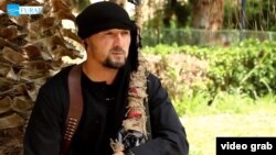 Тәжік полковнигі Гулмурод Ҳалимов, видеодан алынған кадр.