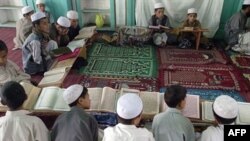 Afghan boys read the Koran at a madrasah in Ghazni Province. President Ghani has stressed that the Koran and Islamic Shari’a law should be the basis of the ongoing peace talks between the government and the Taliban. (file photo)