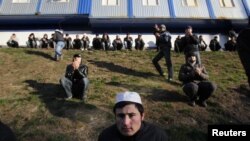 Muslim migrant workers attend special prayers on the first day of the Muslim holiday Eid al-Adha in Moscow in November 2011.