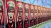 Плакаты на Берлинской стене с изображением президента России Путина и надписью "кровавый Владимир", август 2018 года 