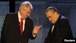 Czech presidential candidates Karel Schwarzenberg (right) and Milos Zeman chat before their final televised debate in Prague on January 24.