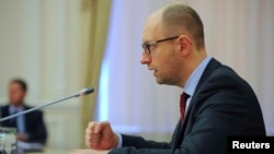 Ukrainian Prime Minister Arseniy Yatsenyuk chairing a cabinet meeting in Kyiv on April 25.