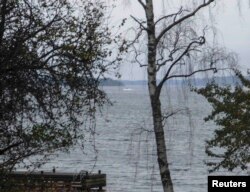 A mysterious object (top center) in the sea near Stockholm on October 19 that Sweden now says was a small submarine.