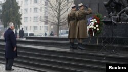 U.S. Secretary of State Rex Tillerson (left) takes part in a wreath-laying ceremony to commemorate International Holocaust Remembrance Day at the Warsaw Ghetto monument in Poland on January 27.