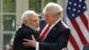 India's Prime Minister Narendra Modi hugs U.S. President Donald Trump as they give joint statements in the Rose Garden of the White House in Washington on June 26.
