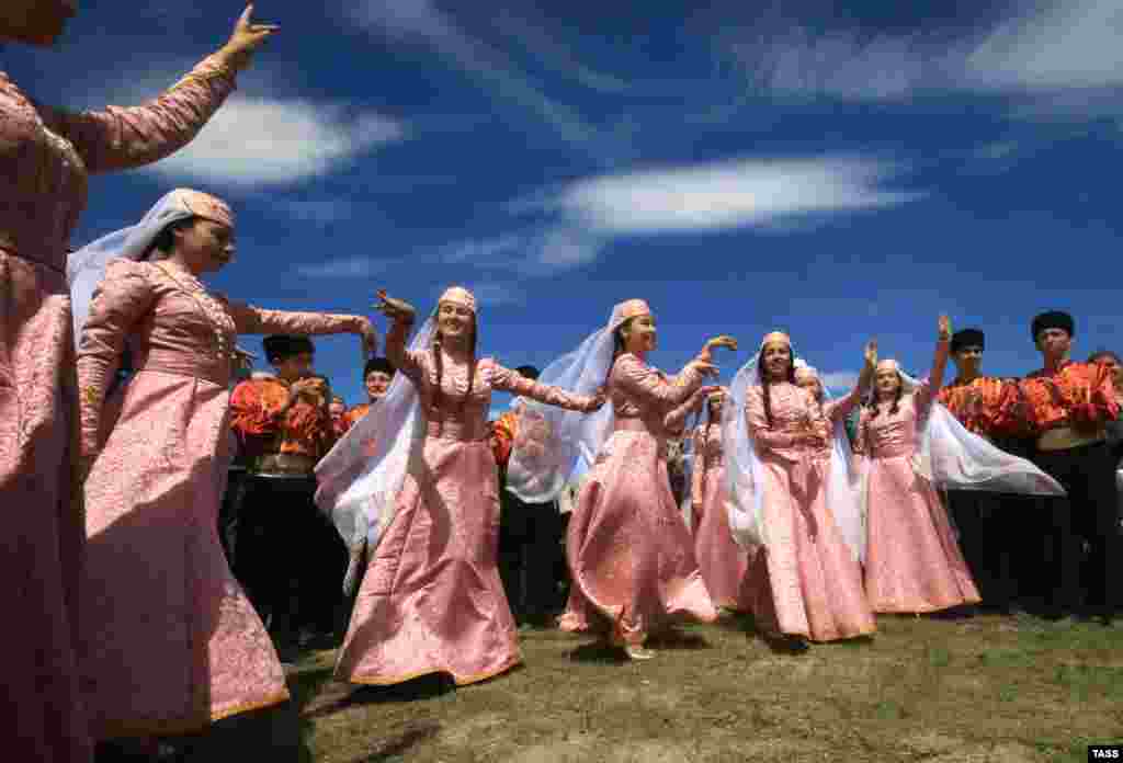 People attend celebrations of Hidirellez, the Crimean Tatar holiday of spring, near the city of Bakhchysaray, Crimea. (TASS/Aleksei Pavlishak)