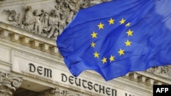 Germany -- A flag of the European Union (EU) flies in front of the Reichstag, the building which houses the Bundestag in Berlin, 05Jun2009