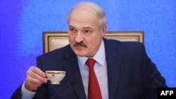 Belarusian President Alyaksandr Lukashenka listens to questions during his seven-hour press conference in Minsk on January 29.