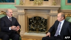 Russian Finance Minister Aleksey Kudrin's comments came ahead of a chilly meeting between Belarus President Alyaksandr Lukashenka (left) and Prime Minister Putin in Minsk on May 28.