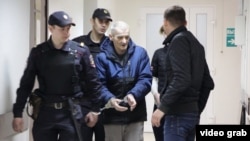 Russian historian Yury Dmitriyevin police custody earlier this year. 