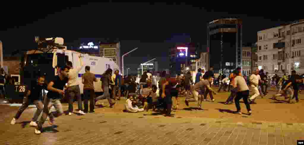 People run and hide as Turkish Army jets fly above Taksim Square in Istanbul. A senior Turkish official has vowed that any aircraft in the hands of coup plotters &quot;will be shot down.&quot;&nbsp;