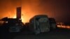 Огонь, охвативший автобусы и грузовики конвоя, направлявшегося в Африн. 23 февраля 2018 года