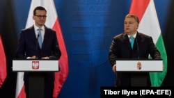 The governments of Polish Prime Minister Mateusz Morawiecki (left) and Hungarian Prime Minister Viktor Orban could face EU pressure.