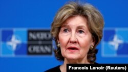 U.S. Ambassador to NATO Kay Bailey Hutchison briefs the media ahead of a NATO defense ministers meeting at the alliance headquarters in Brussels on October 2.