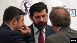 Georgia -- Kakha Kaladze (C), Georgian Energy Minister, speaks with delegates during the14th Georgian International Oil, Gas, Infrastructure and Energy Conference in Tbilisi, March 25, 2015