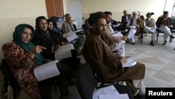 Members of the Loya Jirga, or grand council, take part in a committee session in Kabul on November 22.