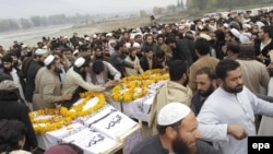 FILE: Supporters attended a mass funeral for nine militants in Dir. They were believed to be killed in a U.S. airstrike in neighboring Afghanistan.