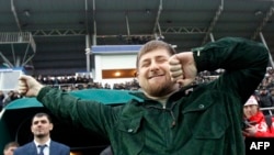 Chechen leader Ramzan Kadyrov (front) performs the Lezginka national dance