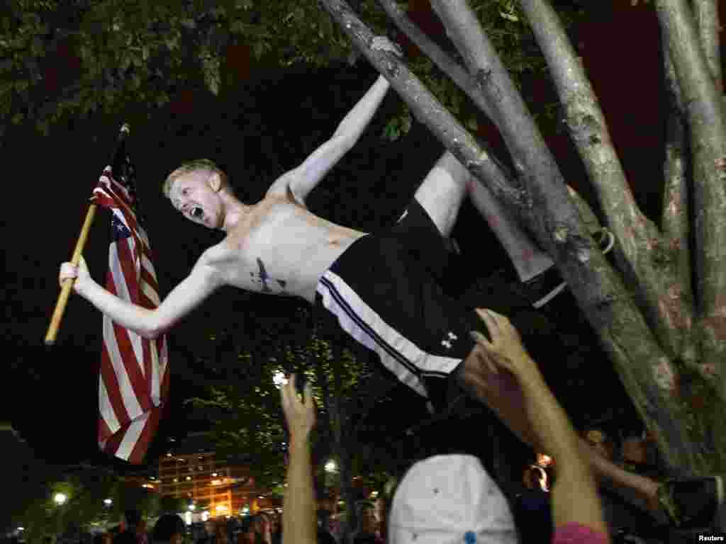 A man cheers outside the White House in Washington upon hearing the news of the death of Osama bin Laden.