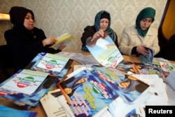 IRPT supporters sort preelection leaflets at the party's headquarters in Dushanbe. In the end, the party garnered a mere 1.5 percent in Tajikistan's March 1 vote.