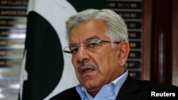 FILE PHOTO: Pakistan's Water and Power Minister Khawaja Asif speaks during an interview with Reuters at his office in Islamabad, Pakistan July 18, 2013./ REUTERS/Mian Khursheed/File Photo